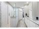 Bright bathroom featuring a tiled shower with glass partition and double vanity with granite counters at 19700 N 76Th St # 2044, Scottsdale, AZ 85255