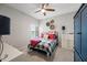 Cozy bedroom with ceiling fan, plantation shutters, and neutral decor at 19700 N 76Th St # 2044, Scottsdale, AZ 85255