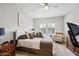 Spacious bedroom with large windows, a ceiling fan and carpet flooring at 19700 N 76Th St # 2044, Scottsdale, AZ 85255