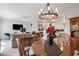 Open-concept dining room with views of the living area and kitchen at 19700 N 76Th St # 2044, Scottsdale, AZ 85255