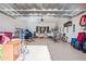 Spacious two-car garage with ample storage, work space, and epoxy flooring at 19700 N 76Th St # 2044, Scottsdale, AZ 85255