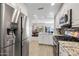 Modern kitchen featuring stainless steel appliances, granite countertops, and white cabinetry at 19700 N 76Th St # 2044, Scottsdale, AZ 85255