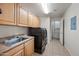 Laundry room featuring updated appliances and storage at 19700 N 76Th St # 2044, Scottsdale, AZ 85255