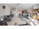 Comfortable living room with neutral tones, plush seating, and a view into the kitchen at 19700 N 76Th St # 2044, Scottsdale, AZ 85255
