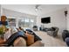 Bright living room with large windows, ceiling fan, and comfortable seating arrangement at 19700 N 76Th St # 2044, Scottsdale, AZ 85255