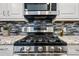 A close up of stainless steel oven, microwave, and gas cooktop at 19700 N 76Th St # 2044, Scottsdale, AZ 85255