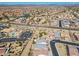 Expansive aerial shot of a community featuring lakes, green spaces, and a mix of housing at 20056 N 107Th Ln, Peoria, AZ 85373