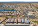 Aerial view of a Primary planned community featuring well-maintained homes and community lakes at 20056 N 107Th Ln, Peoria, AZ 85373