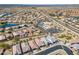 Wide aerial view of a well-planned community with a pool, tennis courts, and green spaces at 20056 N 107Th Ln, Peoria, AZ 85373
