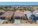 Neighborhood single-story home with tile roof, two car garage, desert front yard at 20056 N 107Th Ln, Peoria, AZ 85373
