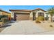 Charming single-story home with desert landscaping, a tiled roof, and a two-car garage at 20056 N 107Th Ln, Peoria, AZ 85373