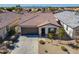 Inviting single-story home with desert landscaping, tile roof, and a two-car garage at 20056 N 107Th Ln, Peoria, AZ 85373