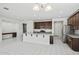 Open-concept kitchen showcases a large island with bar seating, stainless steel appliances, and ample cabinetry at 20056 N 107Th Ln, Peoria, AZ 85373