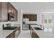 Modern kitchen featuring stainless steel appliances, granite countertops, and ample cabinet space at 20056 N 107Th Ln, Peoria, AZ 85373