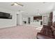 Living room with kitchen, ceiling fan, and tile entryway at 20056 N 107Th Ln, Peoria, AZ 85373