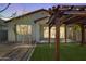 Cozy backyard featuring a charming pergola and an inviting outdoor space at 20056 N 107Th Ln, Peoria, AZ 85373