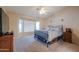 Spacious bedroom featuring a large window, ceiling fan, and neutral colored walls at 2126 E Sherri Ct, Gilbert, AZ 85296