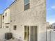 Exterior view of a home with a sliding glass door to a low maintenance backyard at 2181 W Harmont Dr, Phoenix, AZ 85021