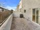 Private backyard with desert landscaping and a covered patio at 2181 W Harmont Dr, Phoenix, AZ 85021