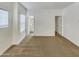 Inviting bedroom with carpet floors, open doorways, and a bathroom view at 2181 W Harmont Dr, Phoenix, AZ 85021