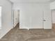 Neutrally decorated bedroom featuring plush carpeting, bright walls, and paneled interior doors at 2181 W Harmont Dr, Phoenix, AZ 85021
