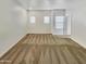 Bright bedroom with carpet floors, three windows, and neutral tones at 2181 W Harmont Dr, Phoenix, AZ 85021