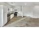 Kitchen boasts stainless steel appliances, white cabinets, dark countertops, and a modern backsplash at 2181 W Harmont Dr, Phoenix, AZ 85021