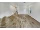 Open-concept living area with tile flooring, white walls, and natural light from the window at 2181 W Harmont Dr, Phoenix, AZ 85021