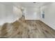 Open concept living room features tile floors and a window overlooking the yard at 2181 W Harmont Dr, Phoenix, AZ 85021