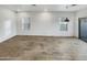 Bright living room with wood-style tile flooring, recessed lighting, and large windows at 2181 W Harmont Dr, Phoenix, AZ 85021