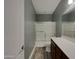Bathroom with a glass sliding shower door, modern vanity and a large mirror at 2297 E Mews Rd, Gilbert, AZ 85298