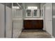 Modern bathroom with a double sink vanity, shower with glass door, and updated fixtures at 2297 E Mews Rd, Gilbert, AZ 85298