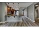 Modern kitchen featuring sleek countertops and cabinetry with stainless steel appliances, and hardwood flooring at 2297 E Mews Rd, Gilbert, AZ 85298