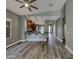 Bright living space showing hardwood floors, modern lighting, and an open concept layout at 2297 E Mews Rd, Gilbert, AZ 85298