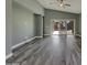 Spacious living room featuring hardwood floors, recessed lighting, high ceilings and sliding glass doors to the backyard at 2297 E Mews Rd, Gilbert, AZ 85298