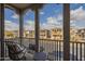 Balcony view of the neighborhood showcasing well-maintained homes and blue skies at 2367 W Dusty Wren Dr, Phoenix, AZ 85085