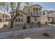 Two-story home featuring a small balcony, arched entry and desert landscaping at 2367 W Dusty Wren Dr, Phoenix, AZ 85085