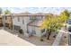 A two-story home with a tile roof, desert landscaping, and an attached two-car garage at 2367 W Dusty Wren Dr, Phoenix, AZ 85085