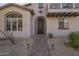 Inviting front entrance with a brick walkway, desert landscaping, and an arched doorway at 2367 W Dusty Wren Dr, Phoenix, AZ 85085