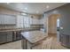 Well-designed kitchen showcases gray cabinets, a central island, stainless steel appliances, and modern countertops at 2367 W Dusty Wren Dr, Phoenix, AZ 85085
