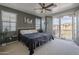 Comfortable main bedroom featuring balcony access with neighborhood views at 2367 W Dusty Wren Dr, Phoenix, AZ 85085