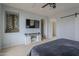 Spacious main bedroom showcasing a media center and a stylish barn door at 2367 W Dusty Wren Dr, Phoenix, AZ 85085