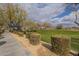 A charming community park with landscaped gardens, trees, and a covered playground at 2367 W Dusty Wren Dr, Phoenix, AZ 85085