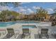 Community pool featuring lounge chairs, a spa, and a playground at 2367 W Dusty Wren Dr, Phoenix, AZ 85085