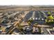 An aerial view shows the layout of homes in a community with desert landscaping and scenic mountain views at 24032 N Rooster Rd, Florence, AZ 85132