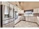 Well-equipped kitchen featuring stainless steel appliances, white cabinetry, and a bright, inviting atmosphere at 25043 S Hollygreen Dr, Sun Lakes, AZ 85248