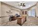 Spacious office featuring custom shelving, neutral tones, and an abundance of natural light from the window at 25043 S Hollygreen Dr, Sun Lakes, AZ 85248