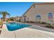 Sparkling pool with desert landscaping, offering a serene and private backyard oasis for relaxation and recreation at 25043 S Hollygreen Dr, Sun Lakes, AZ 85248