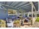 Covered patio featuring stylish outdoor seating, potted plants, and a relaxing ambiance at 2505 E Hampton Ave, Mesa, AZ 85204