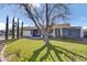 Charming single-story home featuring a well-manicured lawn and mature tree at 2505 E Hampton Ave, Mesa, AZ 85204